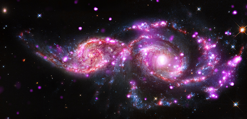 NGC 2207 and IC 2163 are two spiral galaxies in the process of merging.  This pair contains a large collection of super bright X-ray objects called 